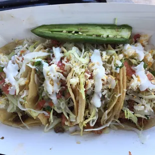 Four tacos. Two beef. Two pork.