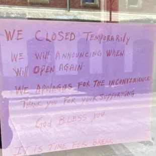 Sign posted on the window.