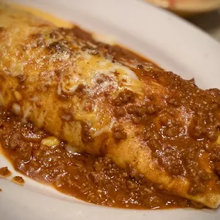 Burrito Deluxe with both Queso and carne sauces