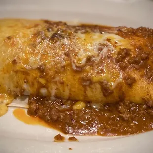 Burrito Deluxe with both Queso and carne sauces
