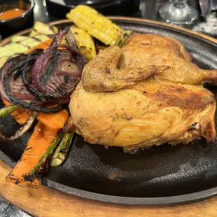 a chicken and vegetables on a plate