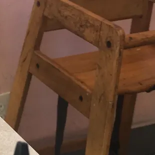 A dirty high chair for the kids.