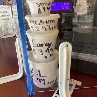 a stack of cups with writing on them