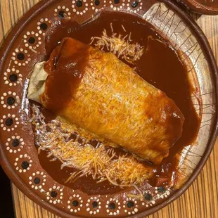 Shredded beef burrito smothered with red chile
