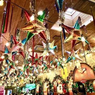 christmas decorations hanging from the ceiling