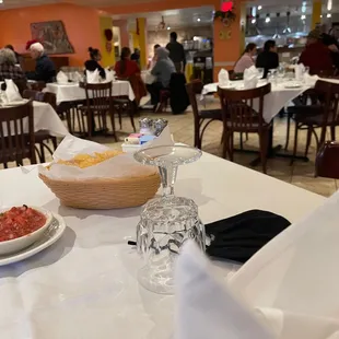 a view of a dining room with tables and chairs
