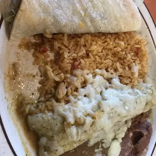 Chicken enchilada with green sauce and a shredded beef taco
