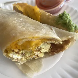 The new breakfast burrito and rolled taco on the side. Loveee the red salsa.