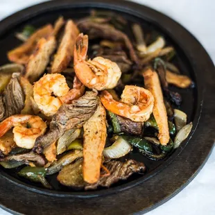 a plate of shrimp and vegetables