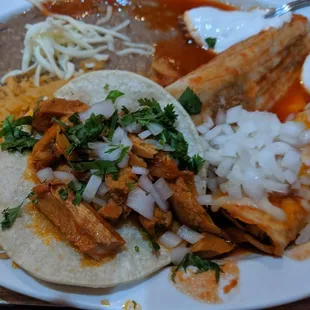 Chicken Taco, Pork Tamale, and Chicken Enchilada.. With rice and beans...