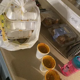 three cups of coffee on a kitchen counter
