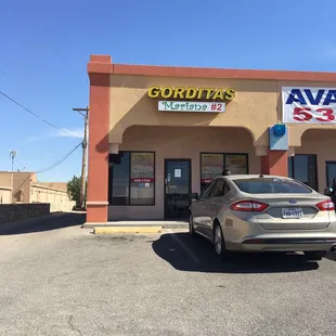 a car parked in front of a store