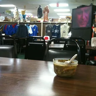 a table with a bowl of soup on it