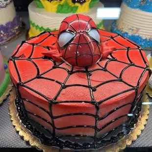 a spider - man cake on display