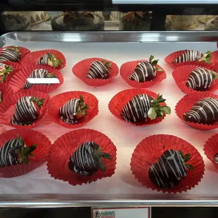 a tray of chocolate covered strawberries