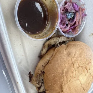 a pulled pork sandwich and coleslaw