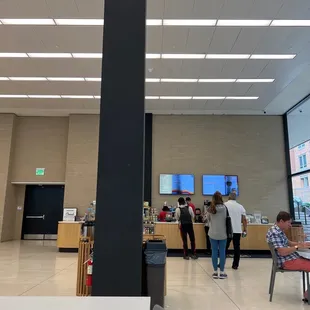 a group of people in a cafeteria