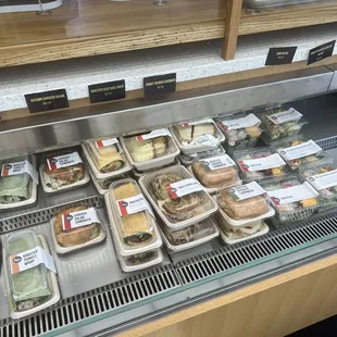 a display of sandwiches and pastries