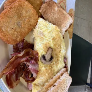 Western omelette, hash browns, bacon and toast.