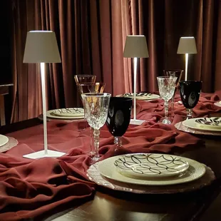 Rental items pictured: EVERYTHING! Drape, farm table, dishes, glassware, linen and...those adorable table lamps!