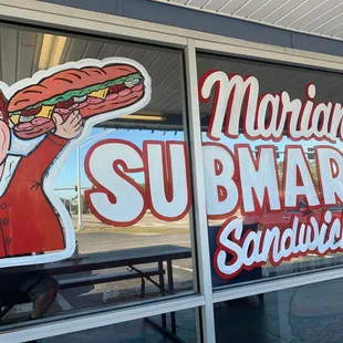 a man holding a hot dog