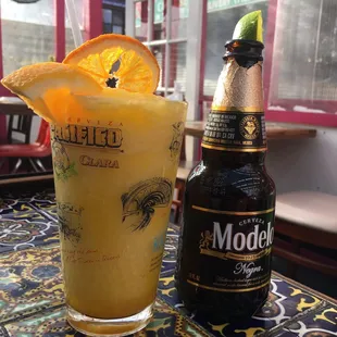Frozen Mango Lemonade and a Negra Modelo Beer on the outside patio
