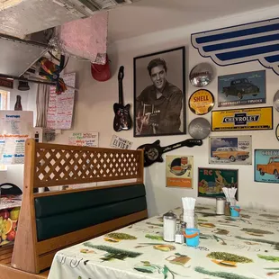 a dining area with a table and chairs