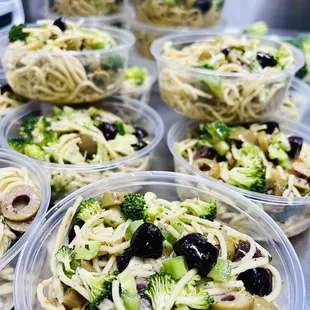 Specialty pasta salad, homemade Greek dressing, red wine vinegar, oregano, olives, green peppers, broccoli