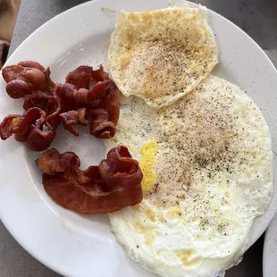 Eggs over medium and crispy bacon