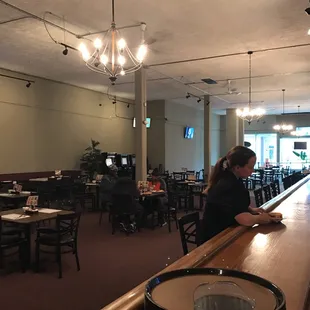 a woman sitting at the bar