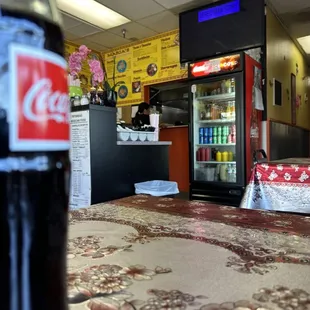 View from out table to the counter. It&apos;s a small establishment but there are additional tables around the back.