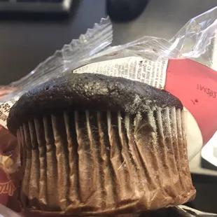 a muffin wrapped in plastic wrap