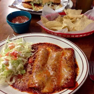 Chicken Enchiladas Mexicana with a side salad and a torta al pastor