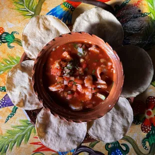 Our delicious ceviche - made with shrimp, avocado, and herbs - perfectly paired with tostadas!