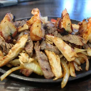 FAJITAS MONTERREY            
Bacon wrapped jumbo shrimp stuffed with monterey cheese and fresh jalapeño, grilled chicken, and beef fa