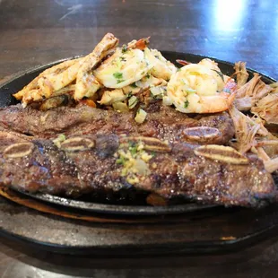 FAJITA DELUXE                    
One of Maria's favorite's pork carnitas, chicken fajitas, beef short ribs, and shrimp.