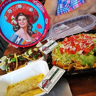 a plate of tacos and a salad