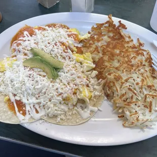 Huevos Rancheros Platter with hash browns.