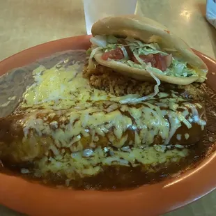 Taco, enchilada, rice, and beans.