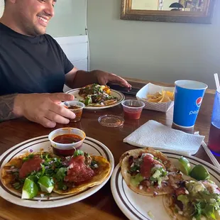 Birria taco, porkie tacos with was smoked pork belly taco