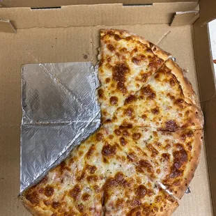 a half eaten pizza in a box