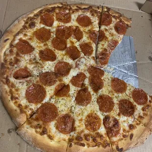 a pepperoni pizza in a box