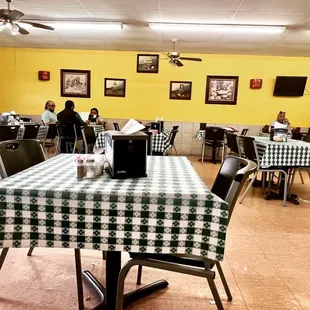 a dining room with a checkered tablecloth
