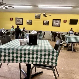 a dining room with tables and chairs