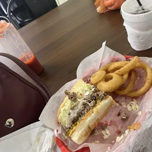 I got the Philly cheesesteak all the way with onion rings and a Coke :) sooo tasty