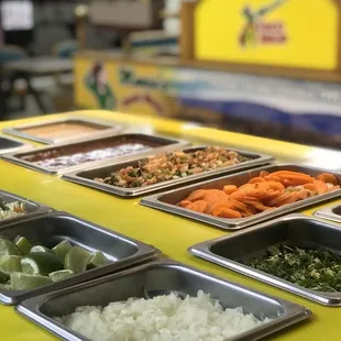 a variety of trays of food