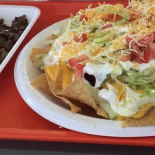 Asada nacho supreme with the asada on the side