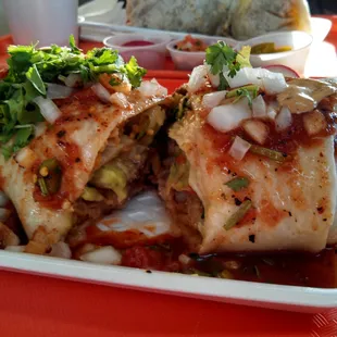 Lengua burrito with guacamole, topped with salsa and cilantro all included for the same price