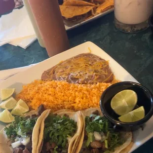 Fresh chips and salsa, birria and asada street tacos, large mugs of horchata.