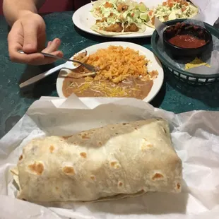 Fish tacos, rice and beans and a California burrito